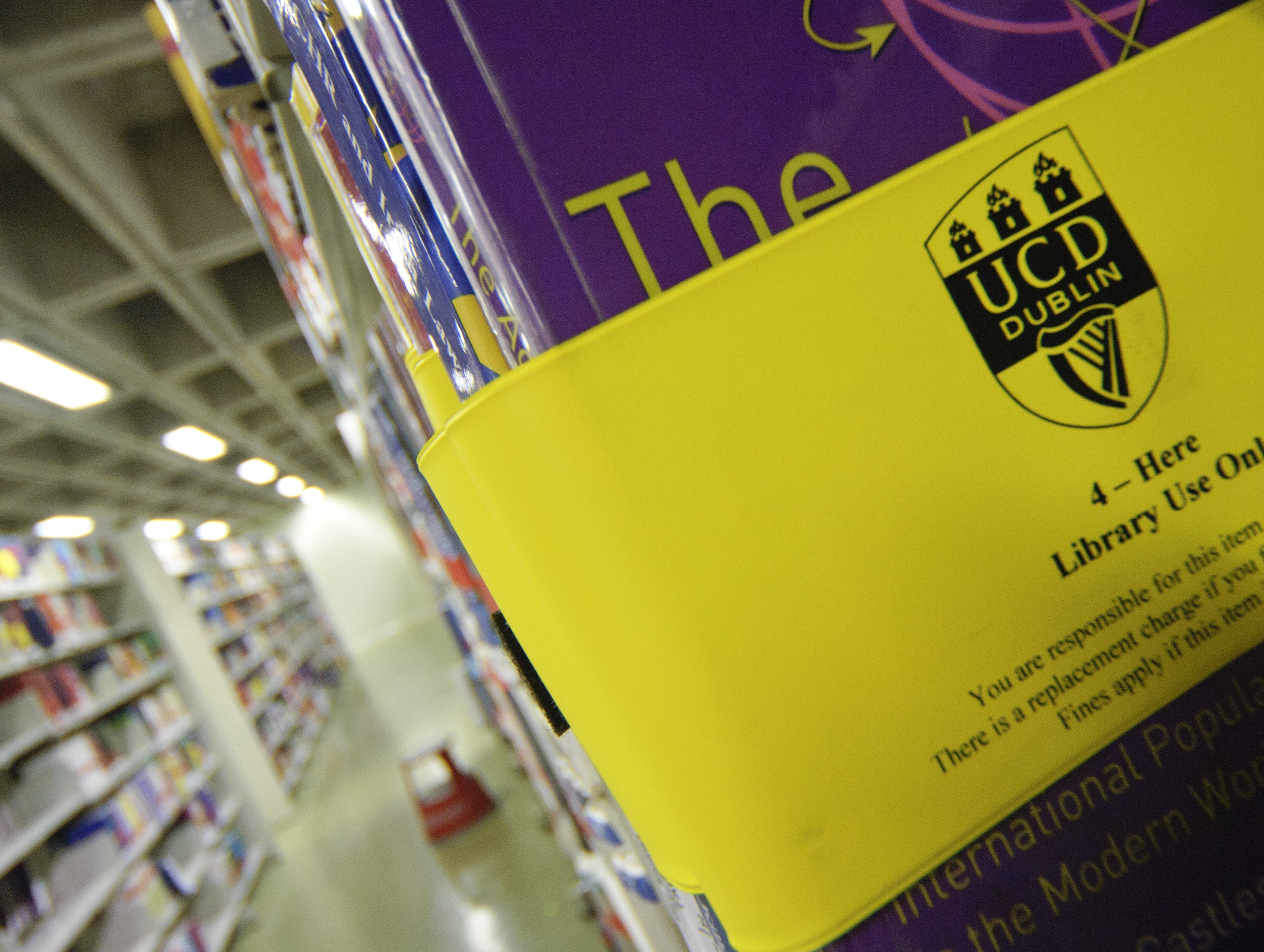 A book in the library with a yellow band around it