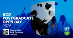 Students in graduation gowns throwing hats in air