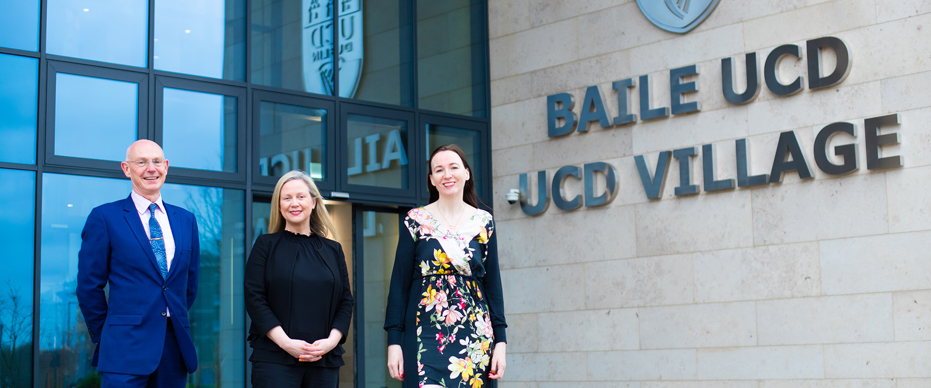 Three Belfield Careers Network team members standing outside the UCD Village