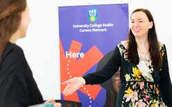 A member of the UCD Careers Network team greeting a student