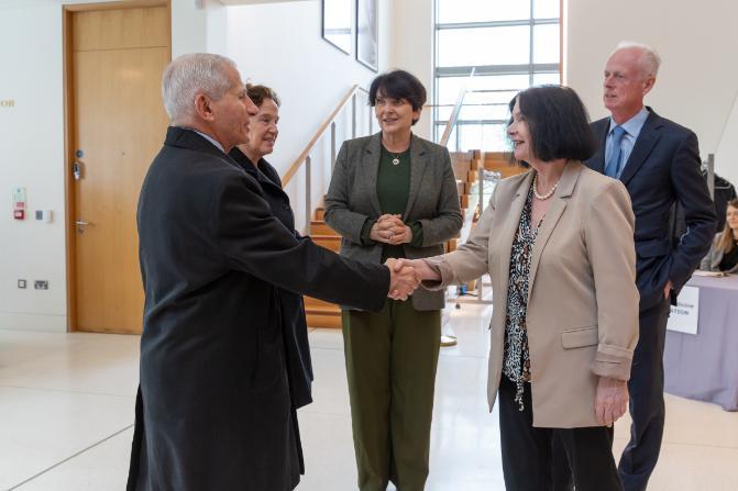 Prof Cecily Kelleher greets Dr Anthony Fauci and guest at UCD Club