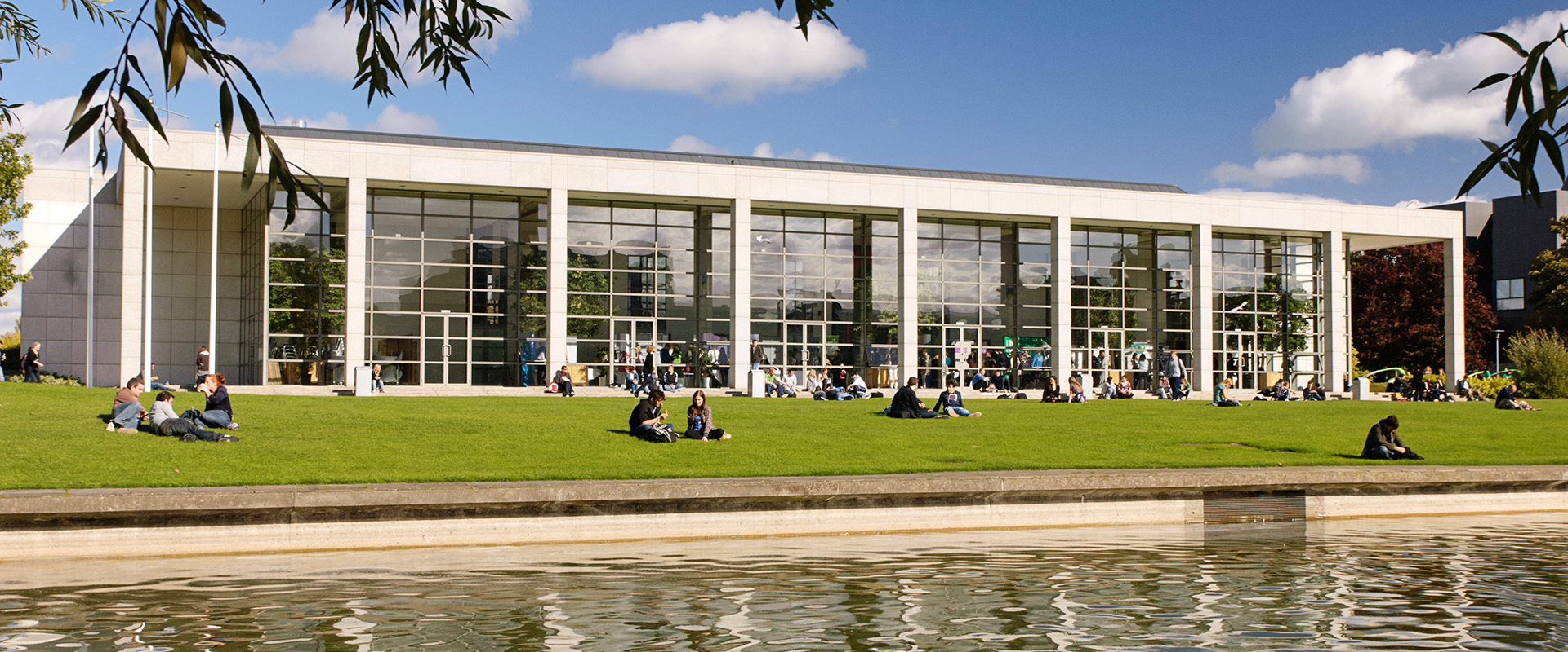 View of O'Reilly Hall across the lake on a sunny day