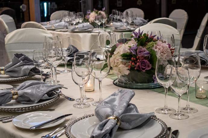 Close-up of place settings on a table at a wedding