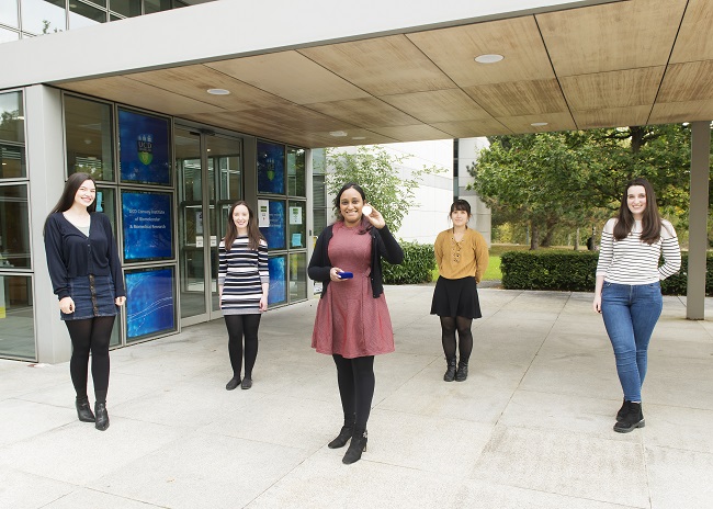 Five smiling prizewinning research scientists