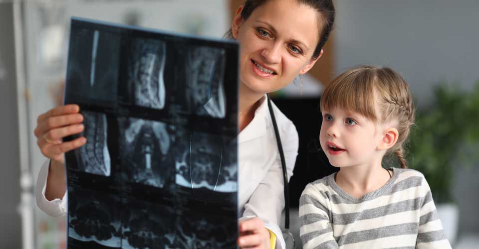 Funding_child_looking_at_xray