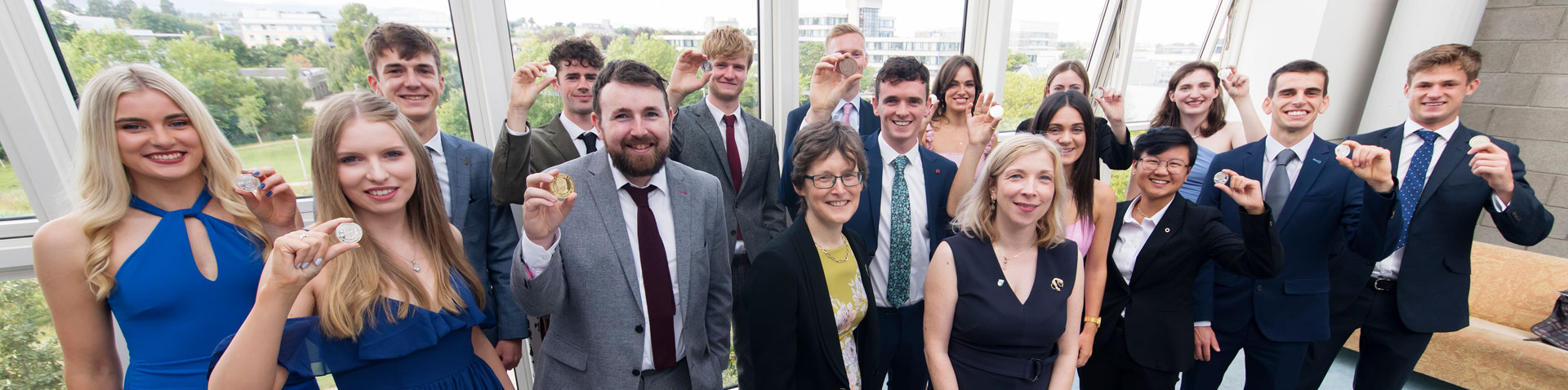 A group shot of engineering gold medal winners with the Dean of Engineering