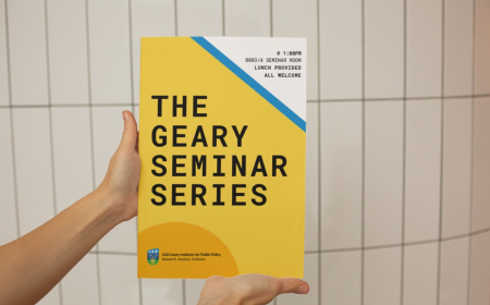 Hands holding a Geary Seminar Series poster