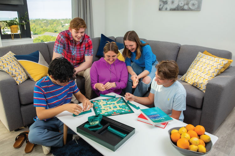 Group of international students together in the living room of new UCD student accommodation