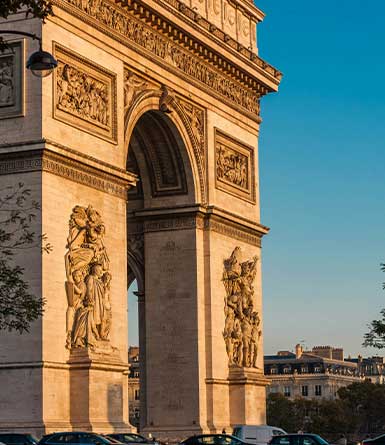A golden sunset over the Arc de Triomphe.