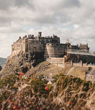 Edinburgh castle on top of a large hill.