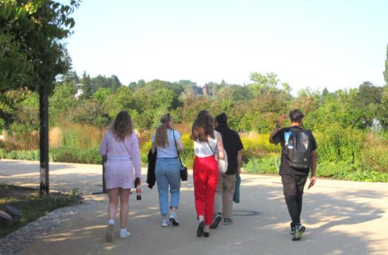 Students walking in a botanical garden.