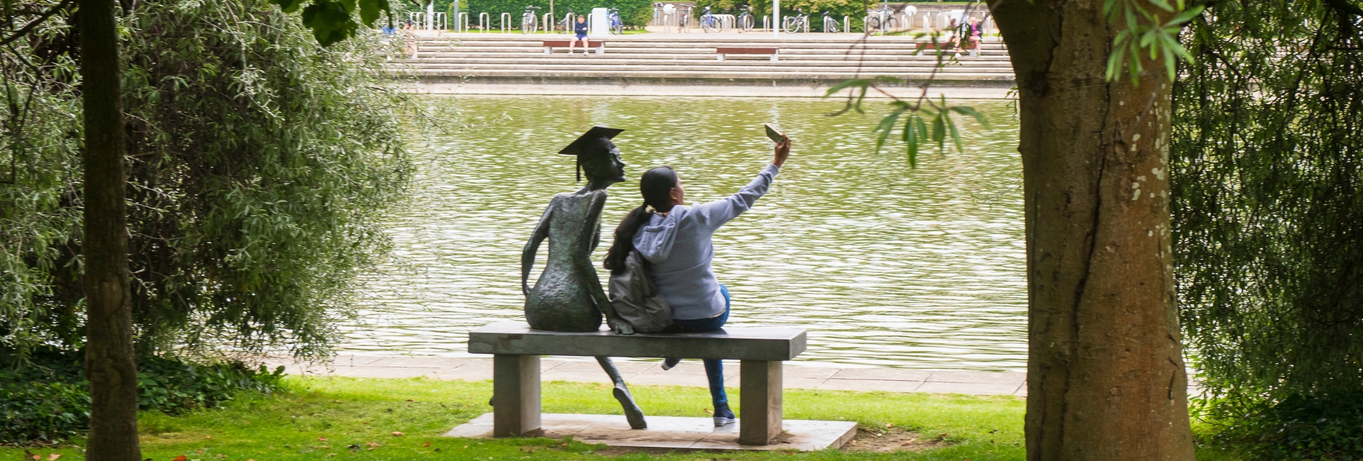 Student taking a selfie with sculpture