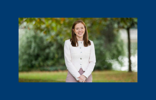 Prof Grainne O'Kane standing with greenery in the background