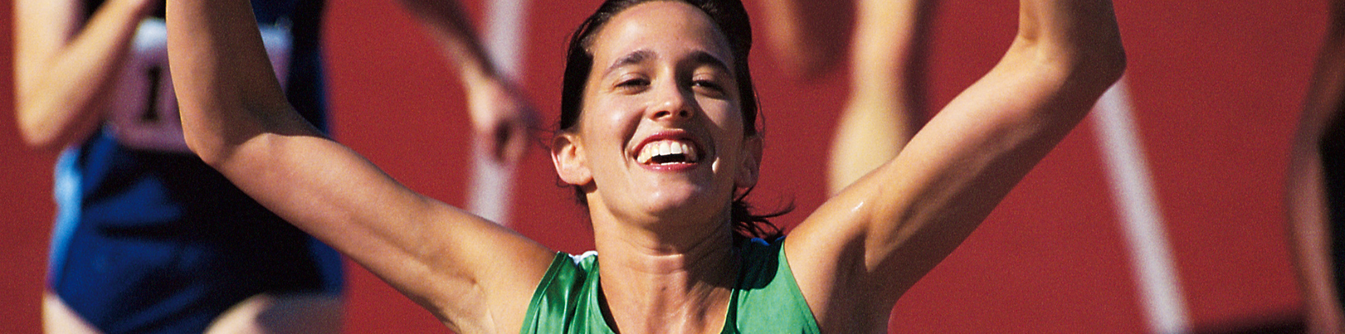 Female athlete winning a race