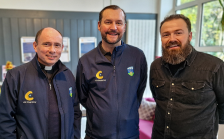 Three UCD Chaplains smiling to camera