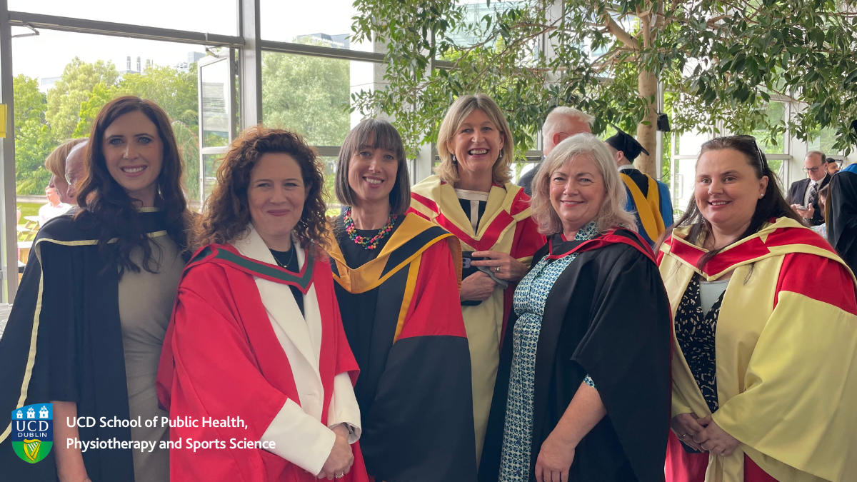 Group of smiling academics in robes