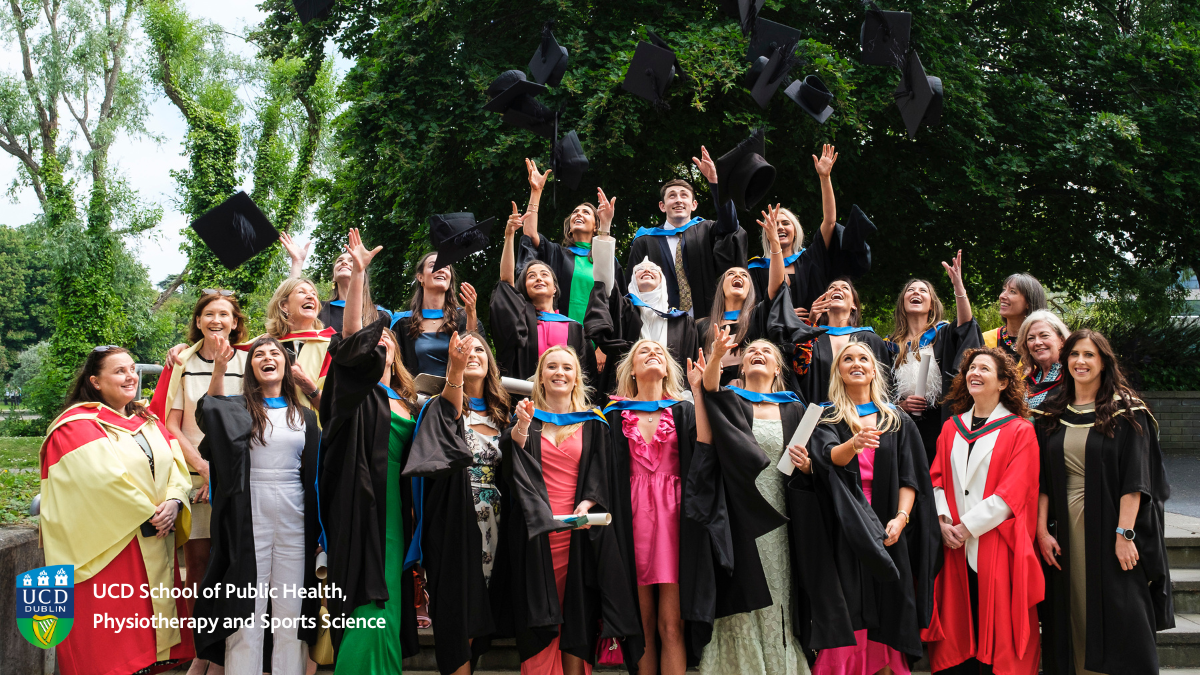 Group of graduates throwing caps