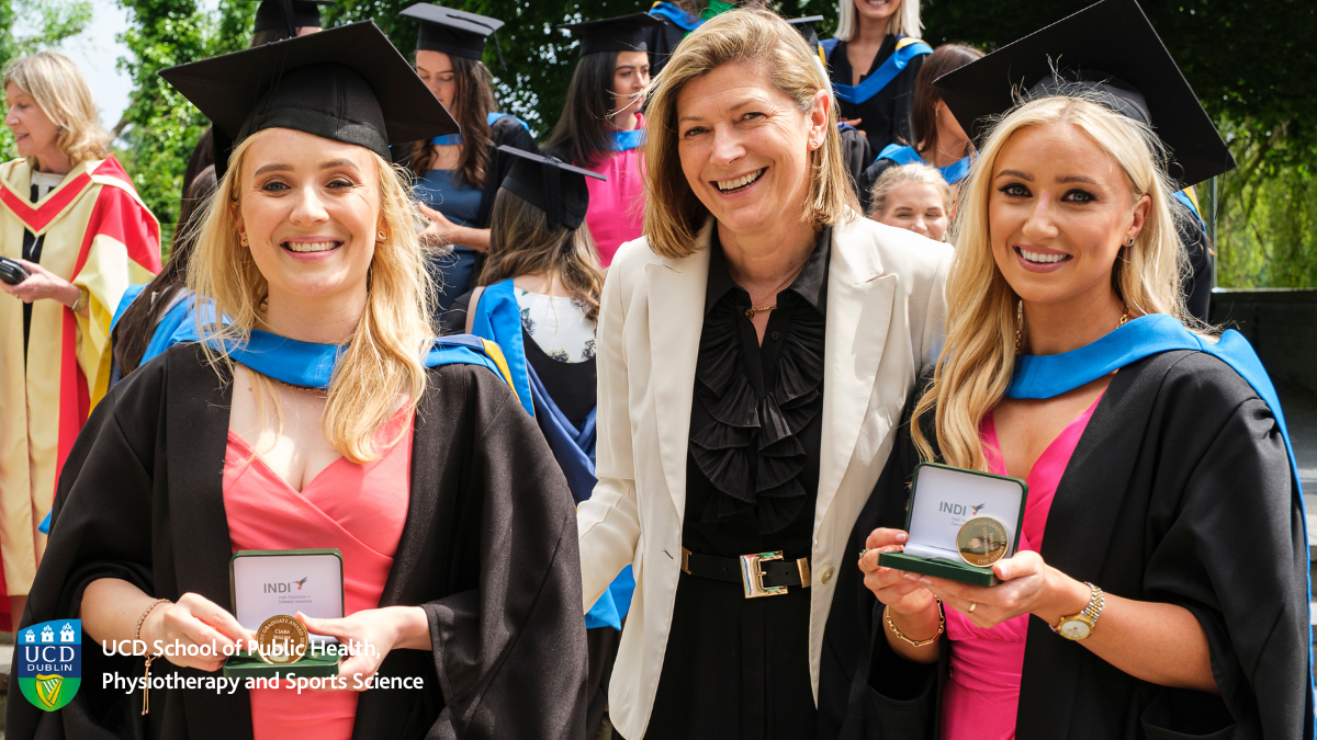 Two students being awarded medals