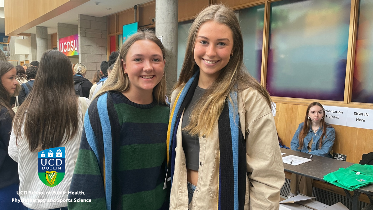 Two students smiling