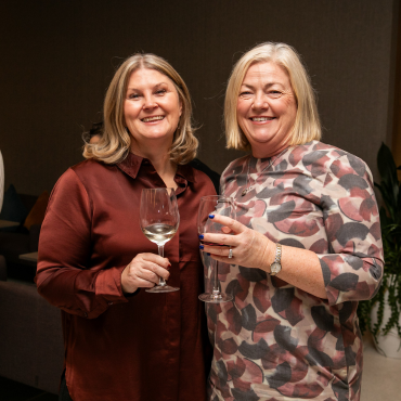 Two women at the UCD Physiotherapy 70th anniversary celebration