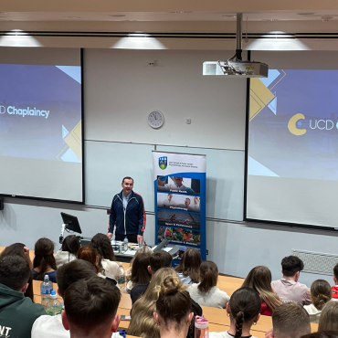 UCD Chaplain speaking to students at orientation