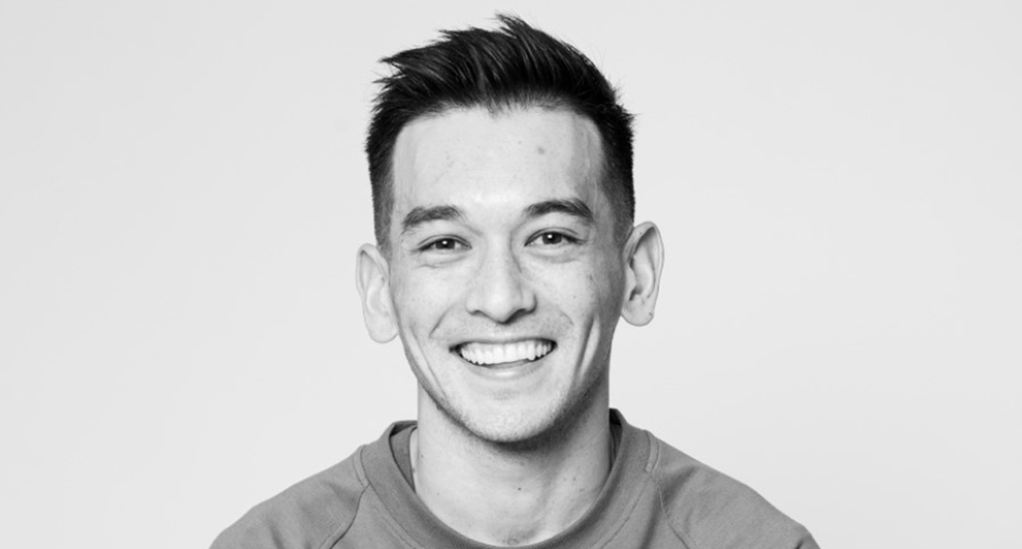 Black and white image of man smiling to camera