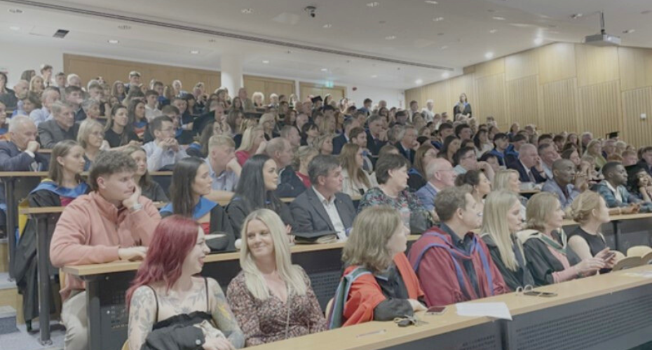 Audience sitting in a lecture theatre at UCD