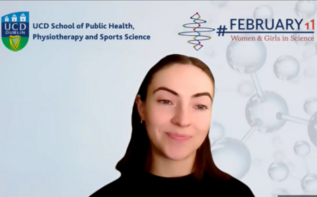 Woman with dark hair in front of light background with UCD and International Day of Women and Girls in Science logos