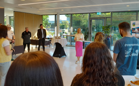 Evanne Ni Chuilinn addressing a crowd of people in UCD University Club