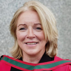 Woman with blonde hair smiling to camera