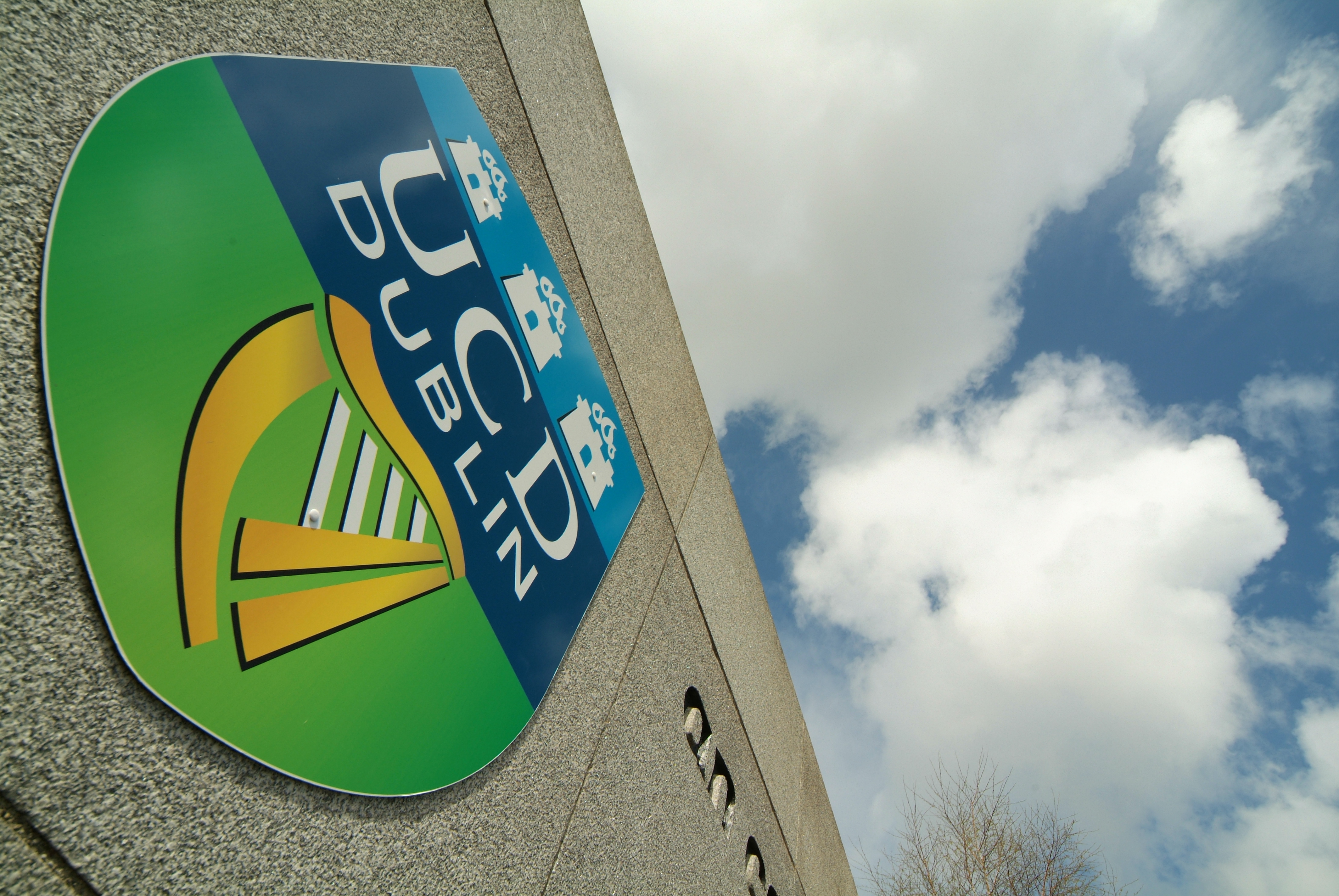 An image of a UCD crest at the entrance to UCD campus