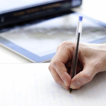 Employee writing on paper