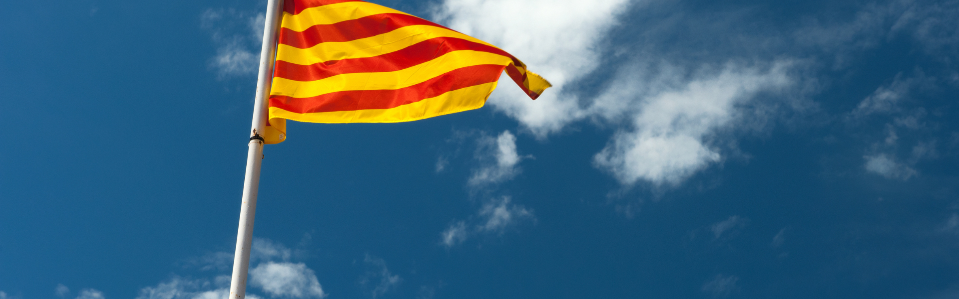 Catalan flag in front of blue sky