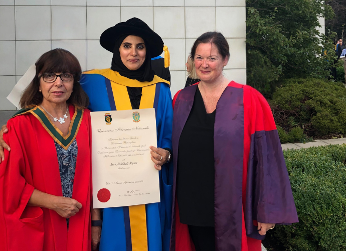 Arwa at graduation with her supervisor