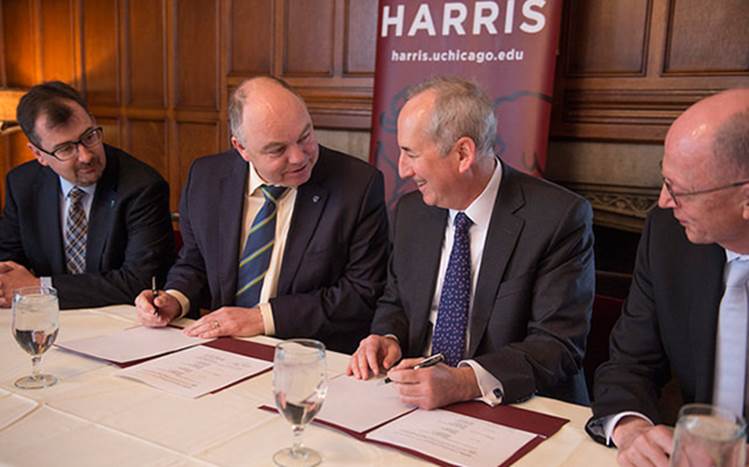 Pictured is Colin Scott, Professor and College Principal at UCD College of Social Sciences and Law; UCD President Andrew Deeks; UCD Alumnus Colm O'Muircheartaigh, Professor and former Dean at Chicago Harris; and Chicago Harris Provost Eric Isaacs at the signing ceremony at the University of Chicago on April 22 (Photo by Rob Kozloff).
