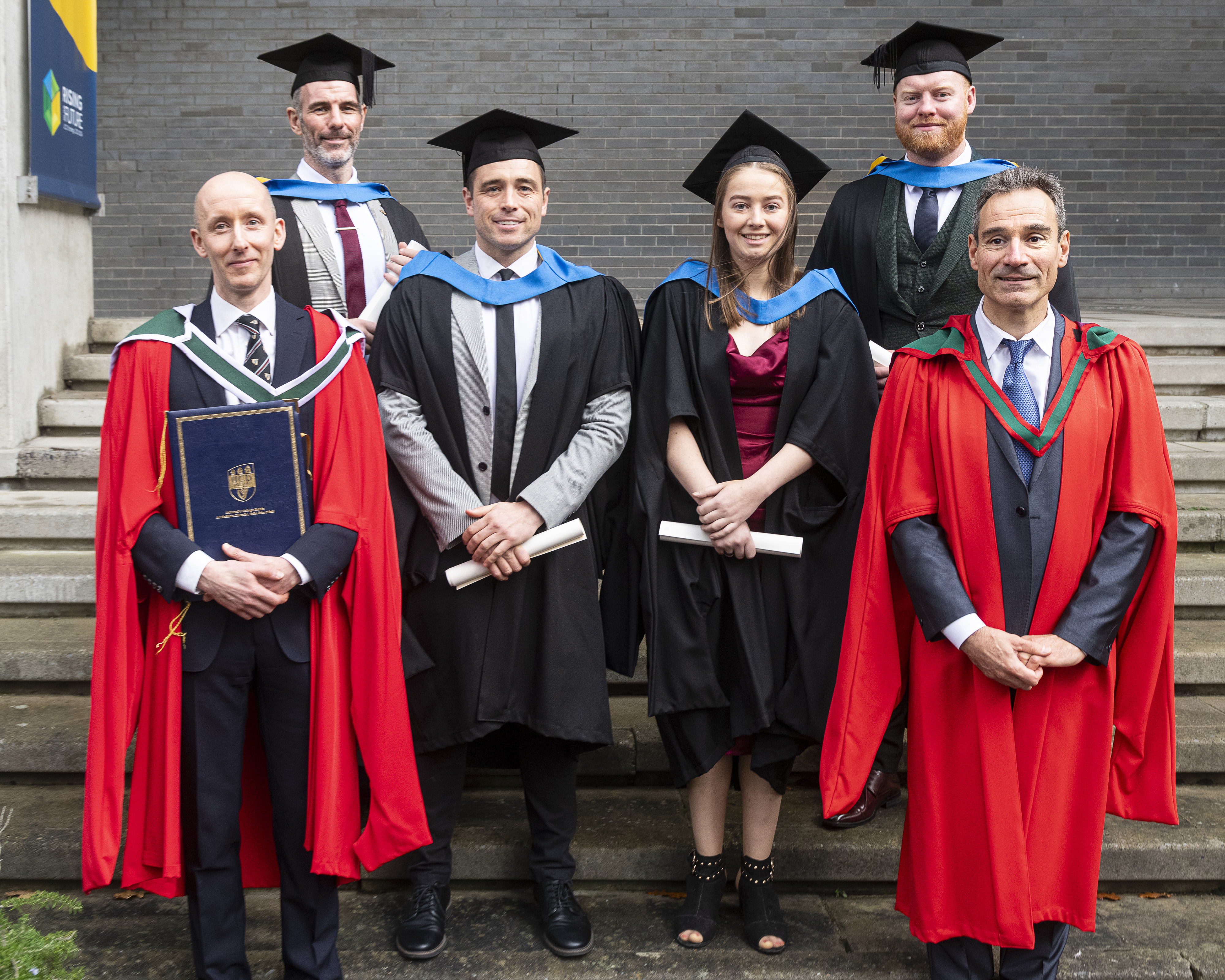 Students in academic dress after their conferring ceremony