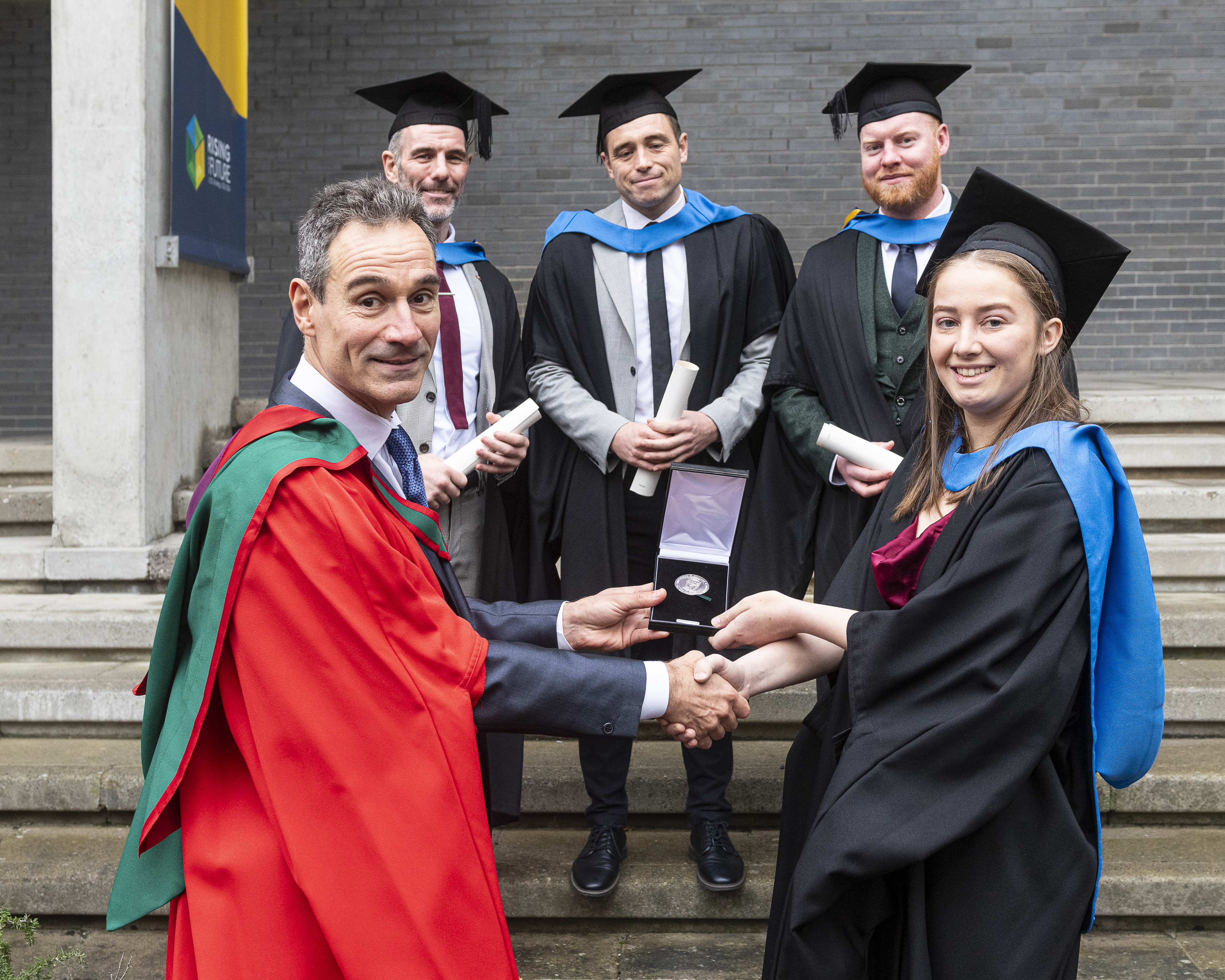 A student receiving an award