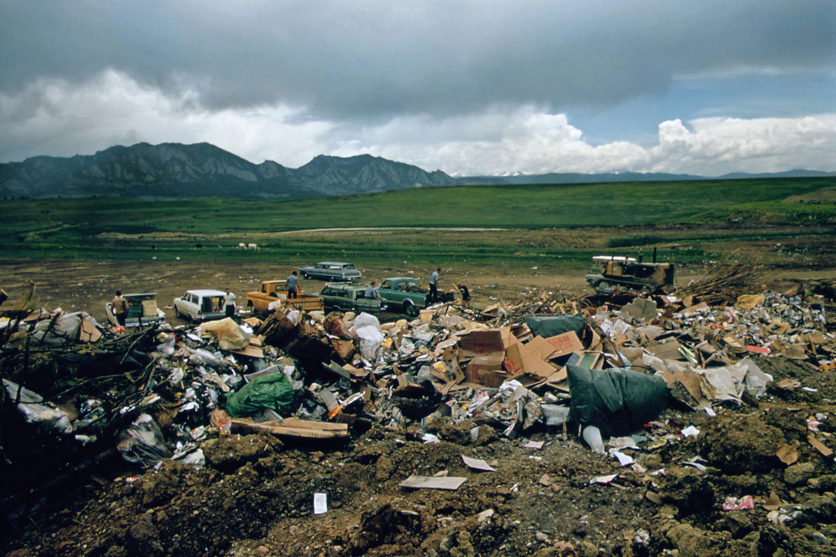 Landfill with green mountain background