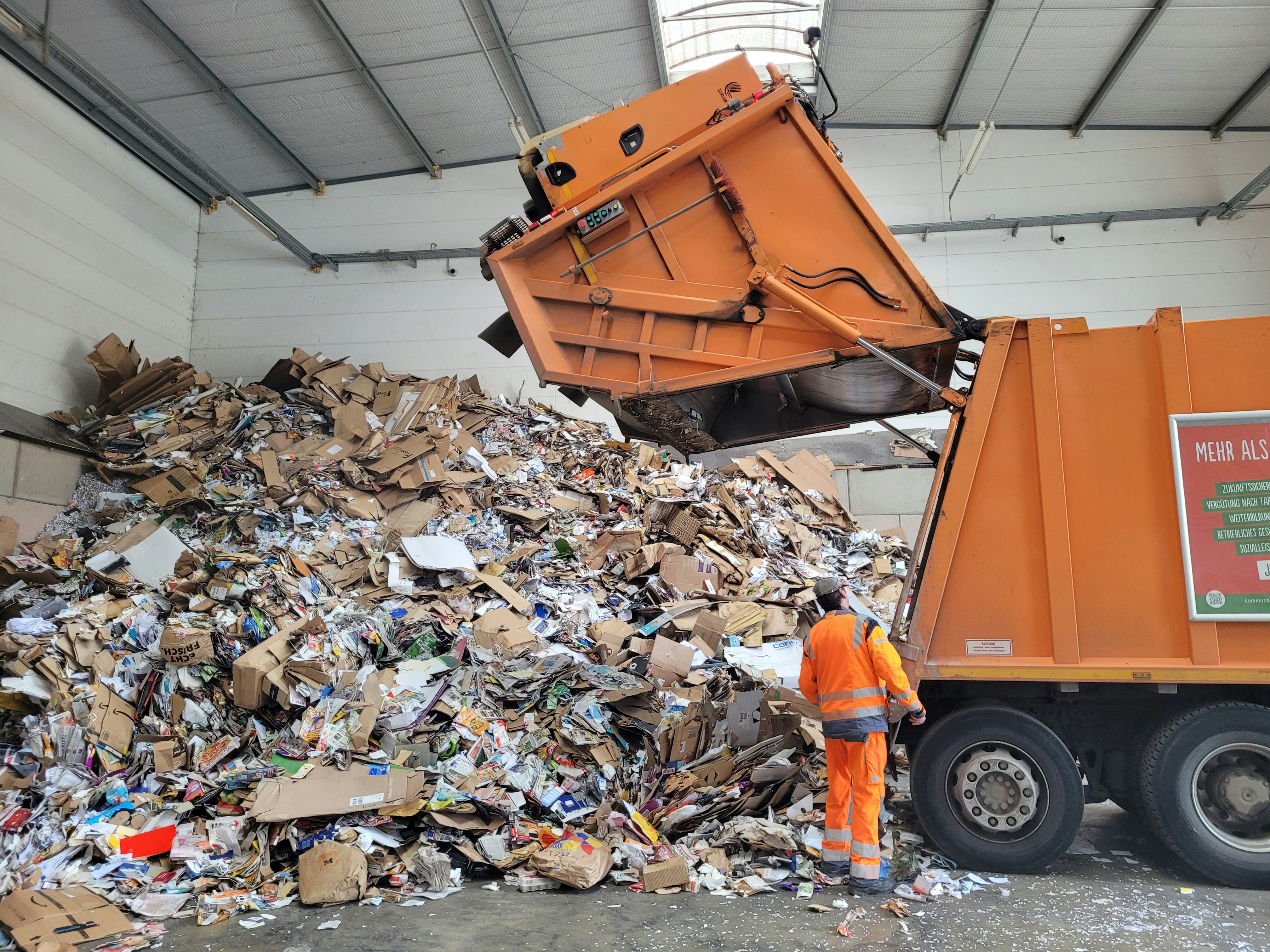 Truck emptying contents in a recycling facility