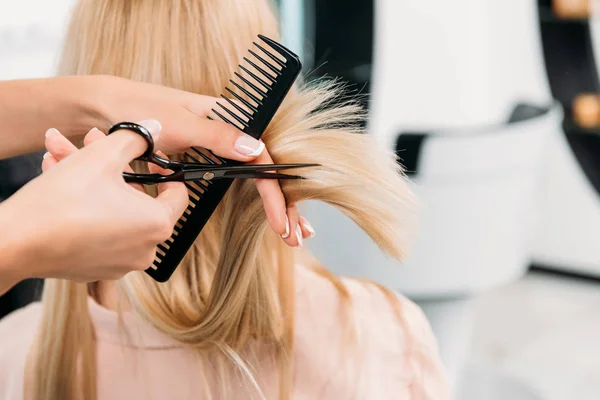 A woman walks past the Blow Beauty Salon on UCD Belfield Campus