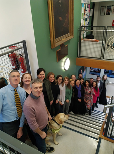 Group of people standing on the the stairs in the Vet School