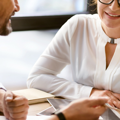 Image of two people talking