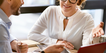 Image of two people talking